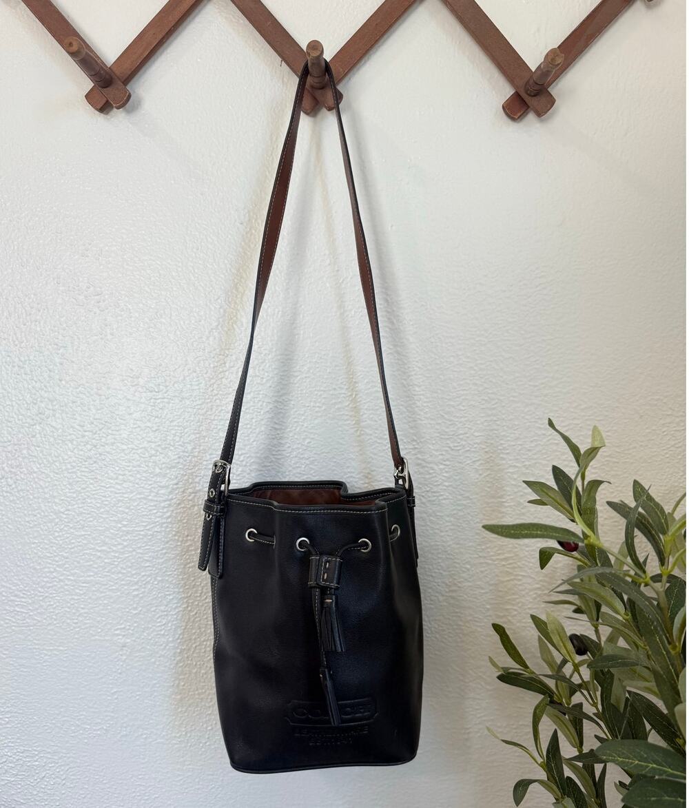 Coach Black Leather Drawstring Bucket Bag Embossed Logo Tassel Crossbody 7554
